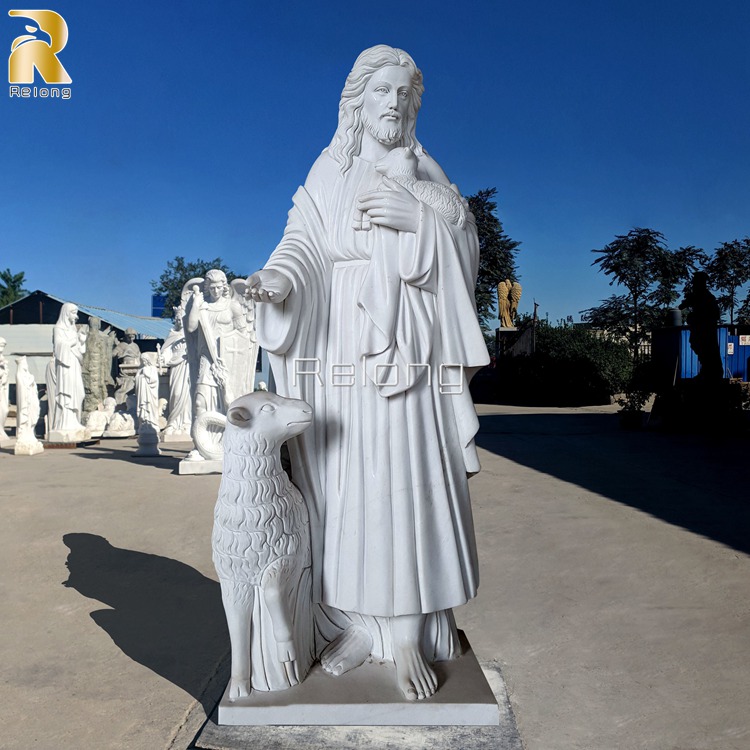 white marble jesus statue with sheep