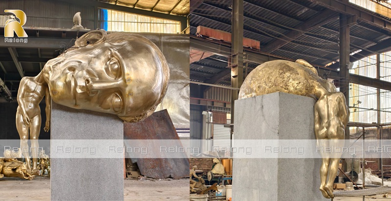 casted bronze big head sculpture