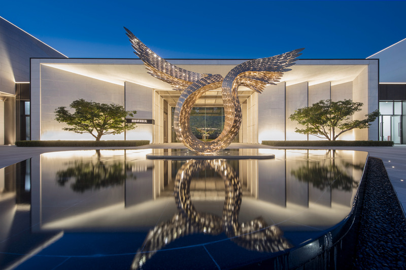 metal wing sculpture with light