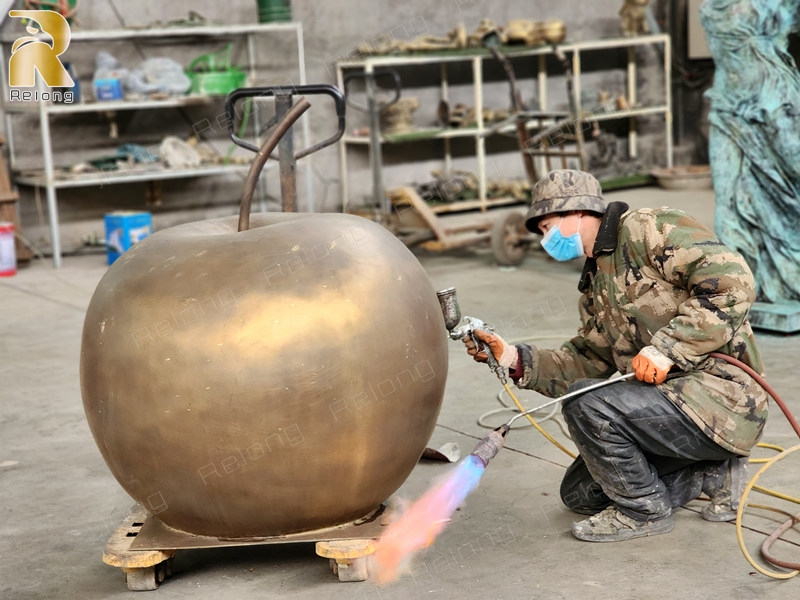 patina coloring of apple statue (2)