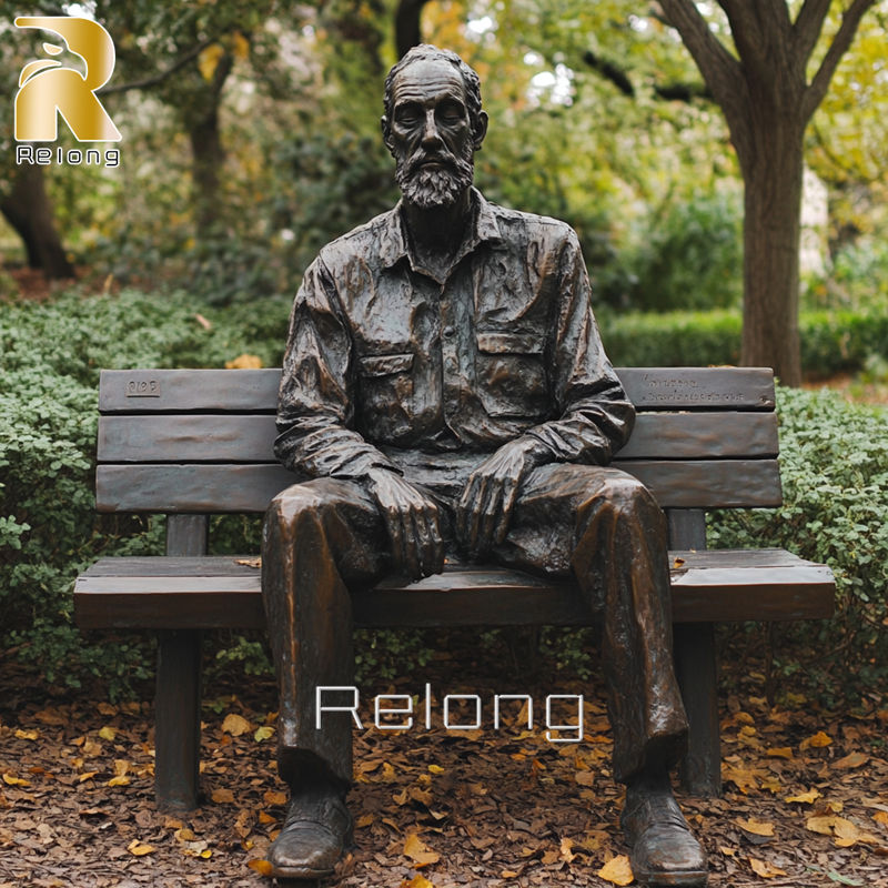 Bronze Statue of Man Sitting on Bench