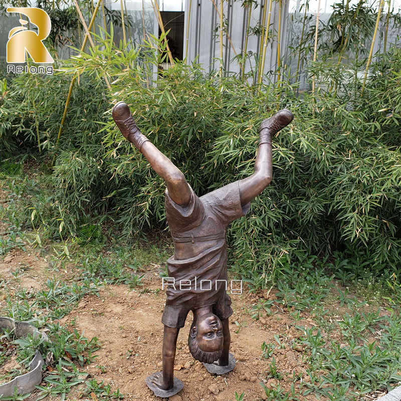bronze handstand boy sculpture