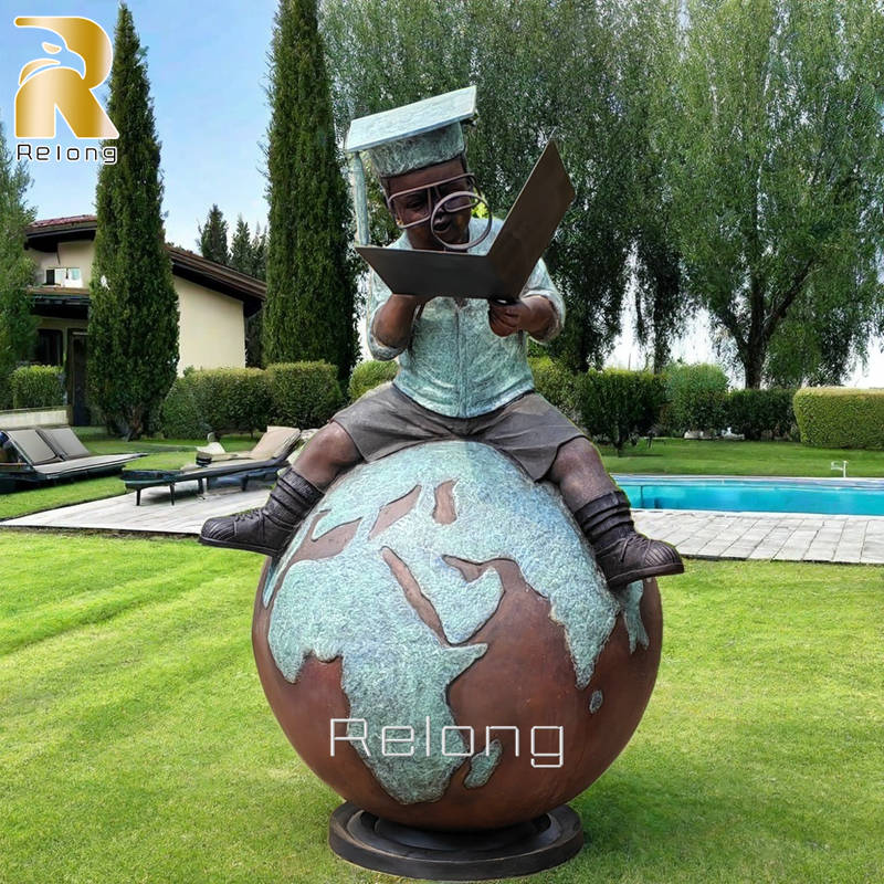 life size bronze boy reading statue