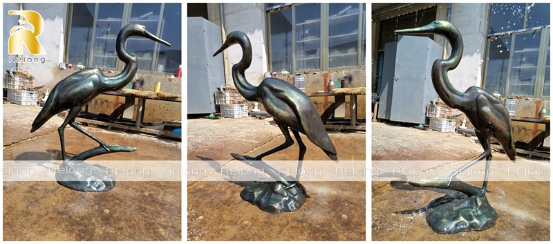 bronze heron statue at factory