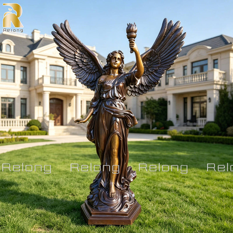 angel holding torch sculpture