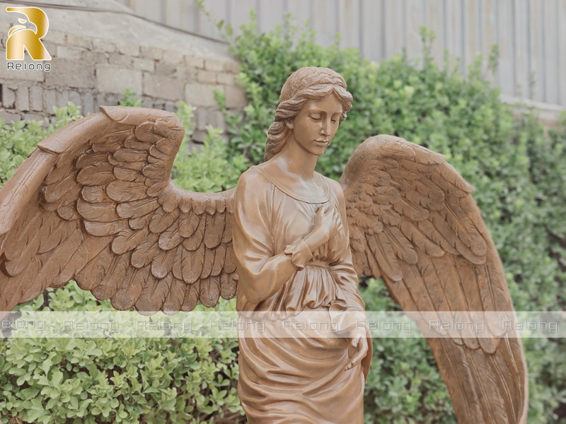delicate bronze guardian angel statue details