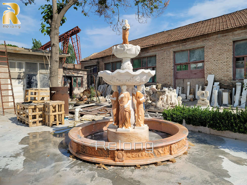 elegant marble fountain with female figures