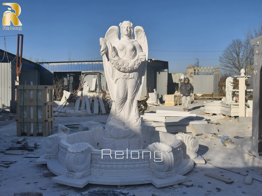 hand carved marble fountain with angel statue