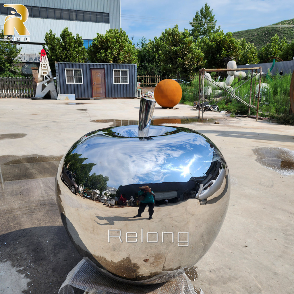 polished metal apple sculpture