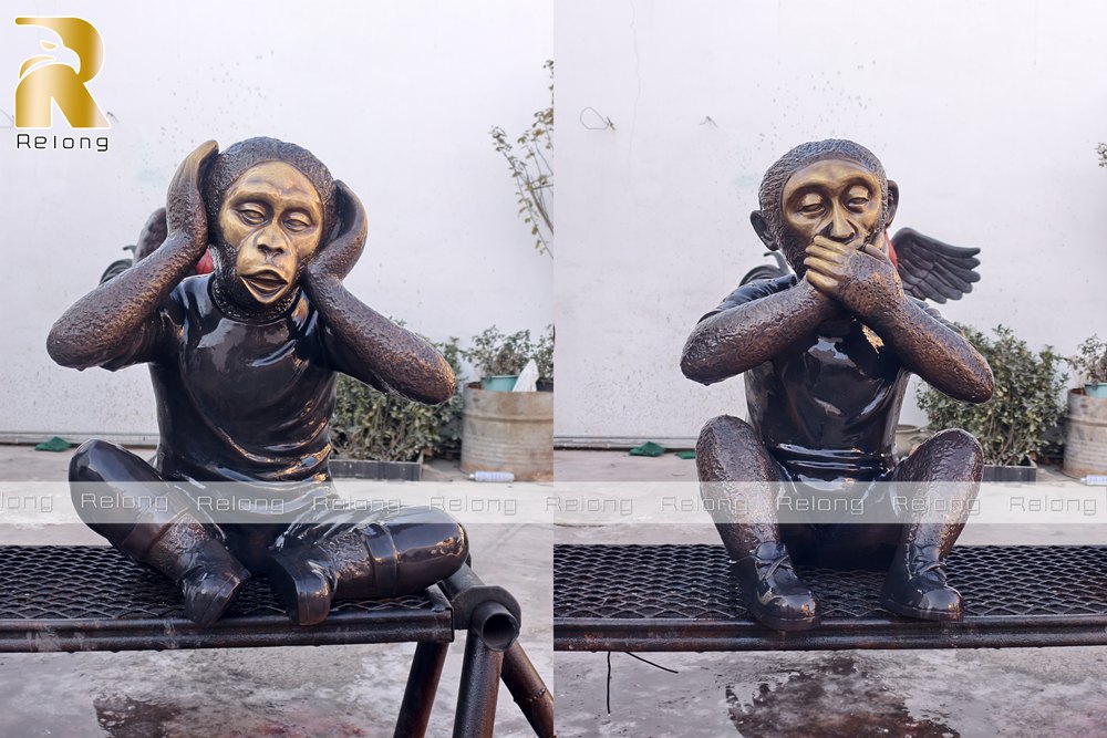three wise monkeys statue details