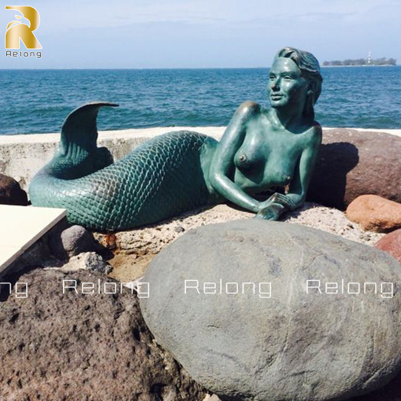 life size lying mermaid statue
