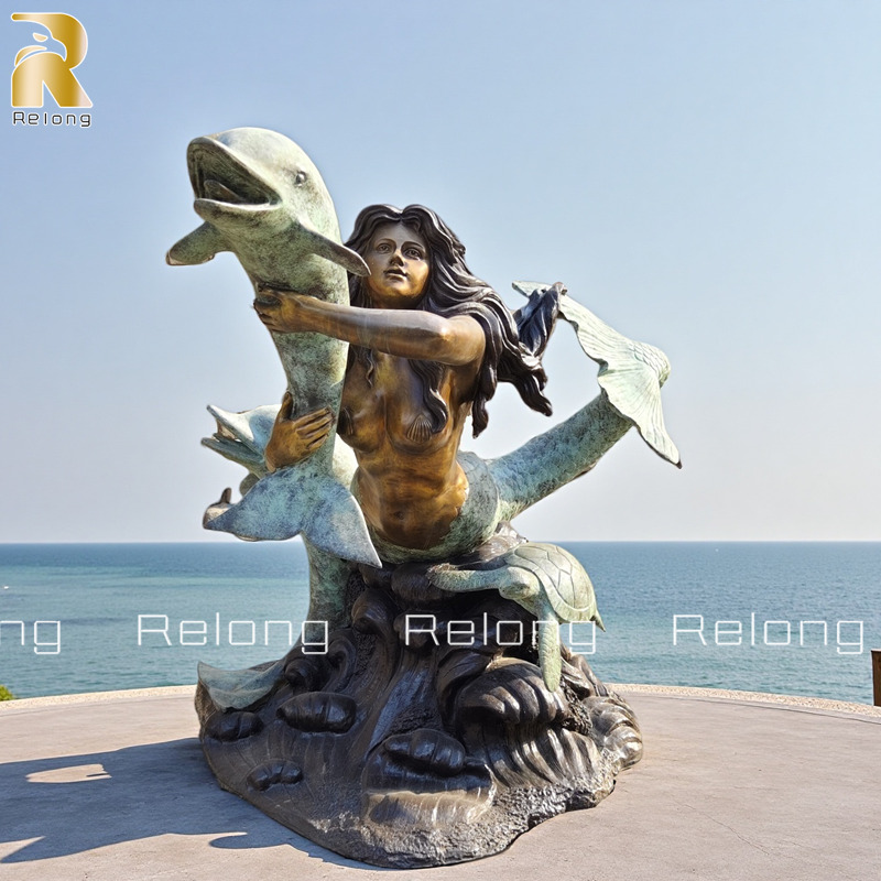 beautiful mermaid with dolphin statue