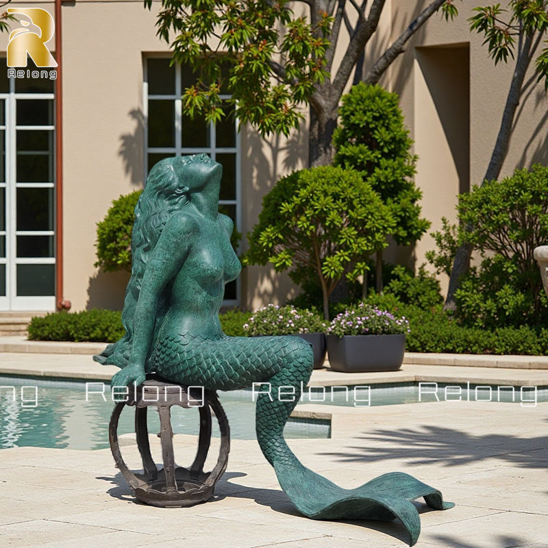 bronze sitting mermaid statue
