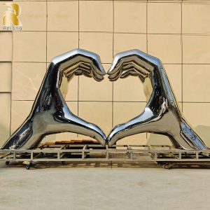 large stainless steel hand sculpture