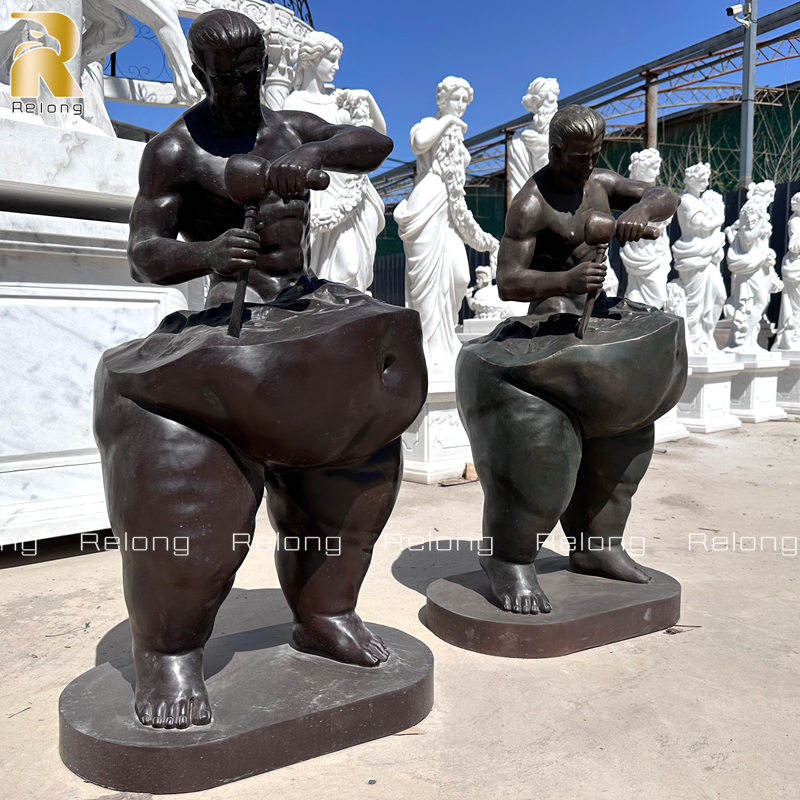 life size man sculpting himself statue