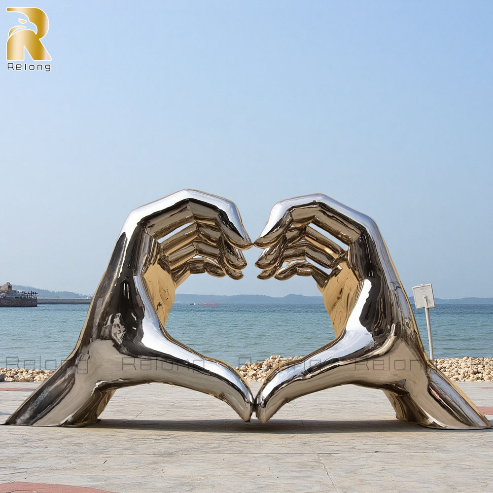 mirror polished hand heart sculpture