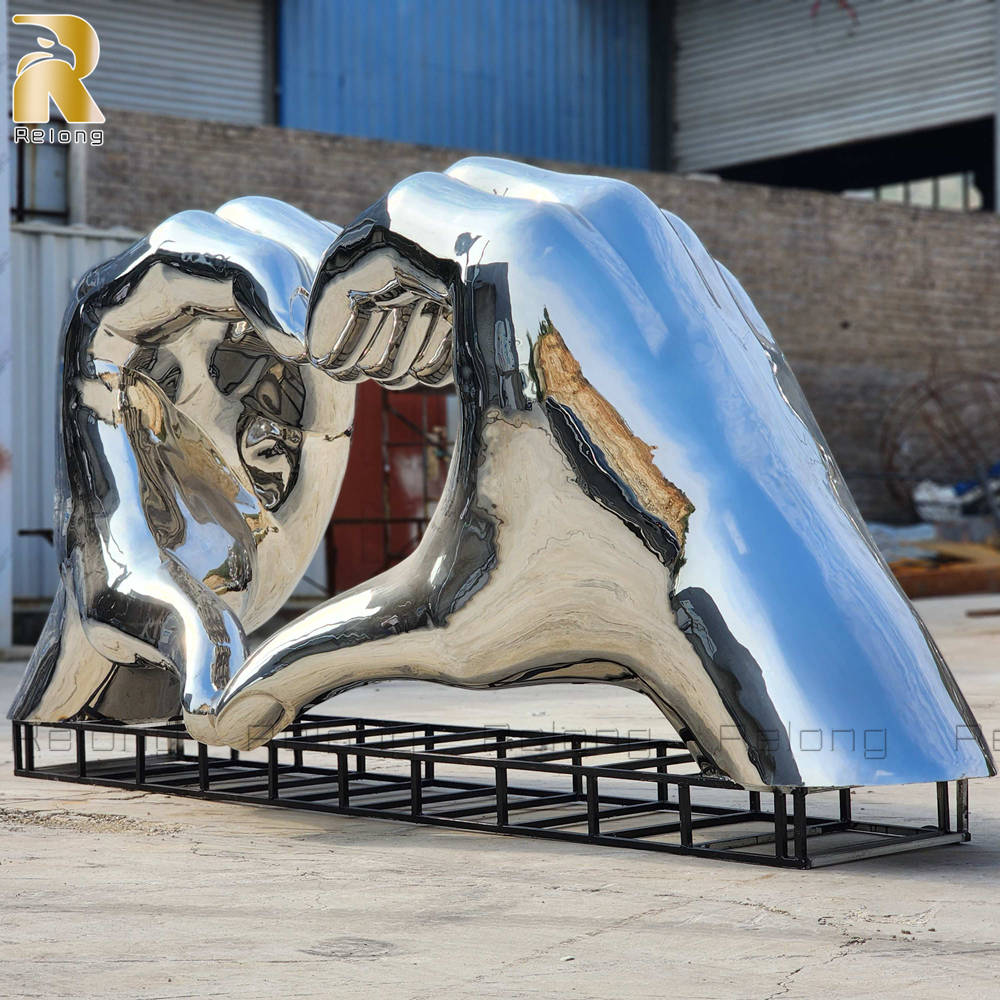 mirror polished hand sculpture