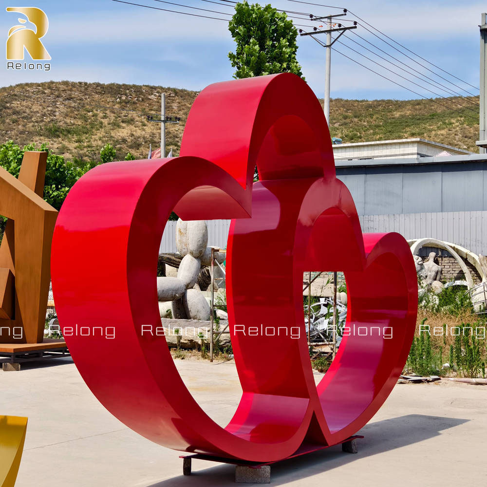 red stainless steel heart sculpture