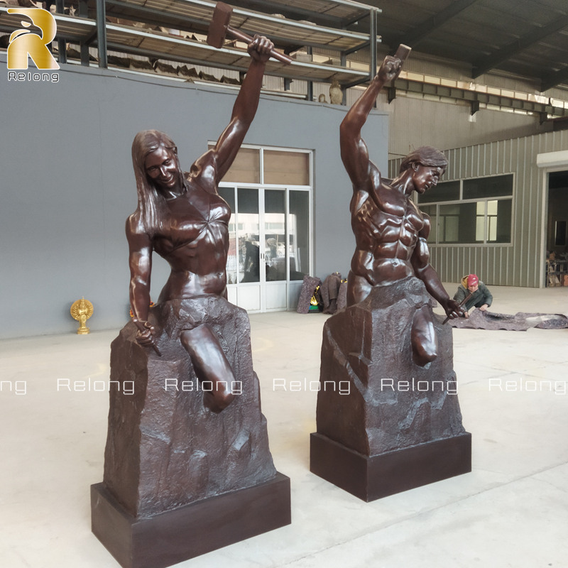 bronze self made woman and self made man sculpture
