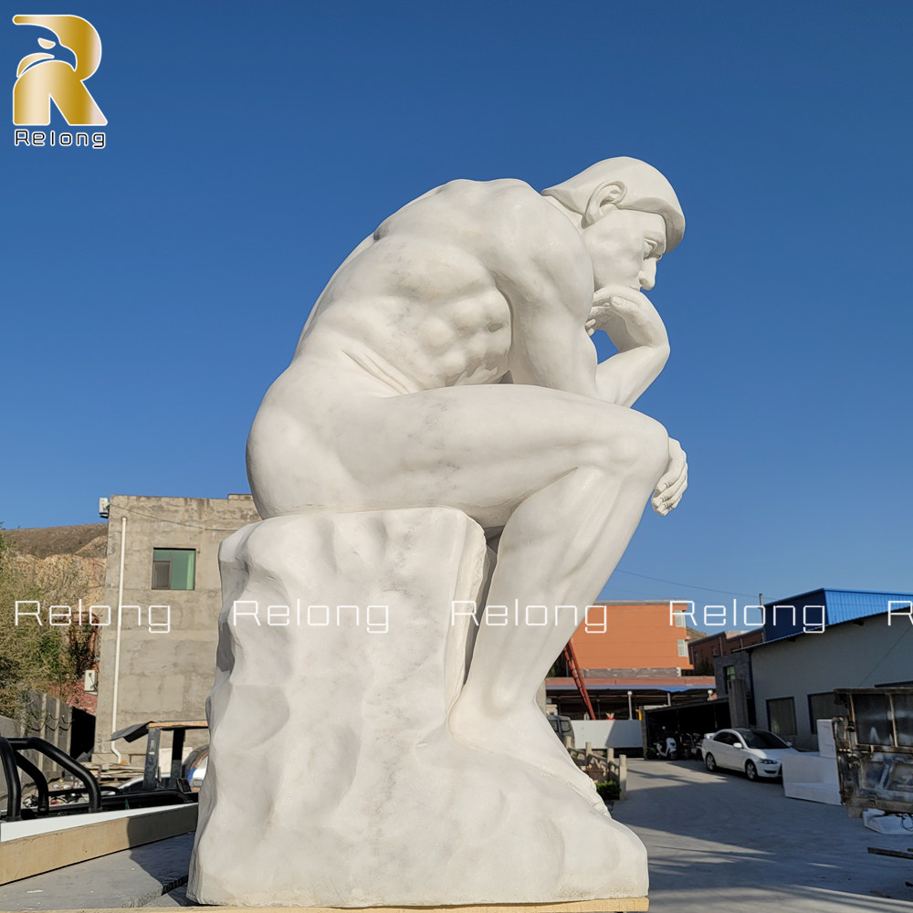 carved marble thinker statue