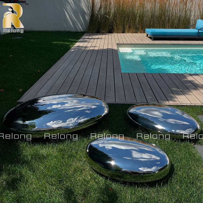 metal pebble sculpture for pool decor
