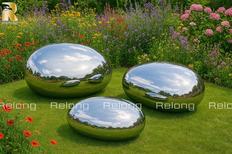 modern stainless steel pebble sculpture