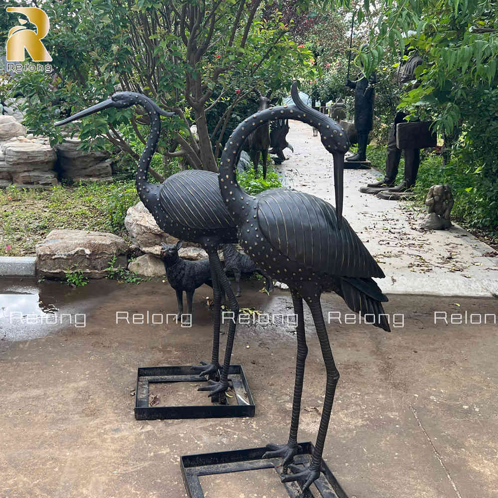 elegant cast bronze crane sculpture