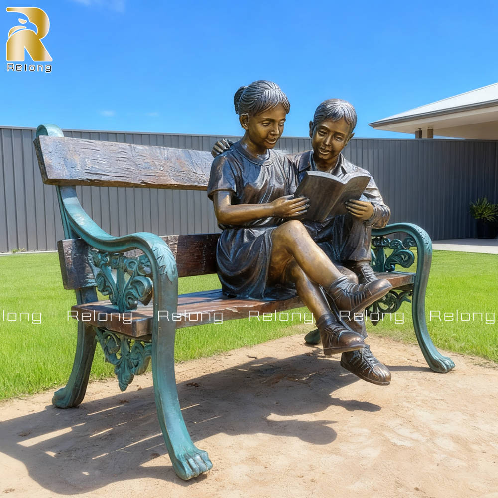 boy and girl on a bench statue for outdoor decor