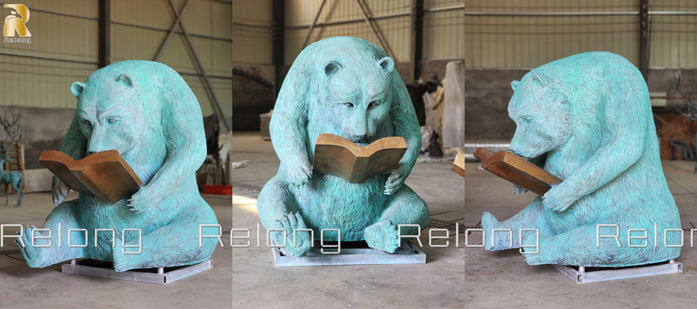 bear reading garden statue details