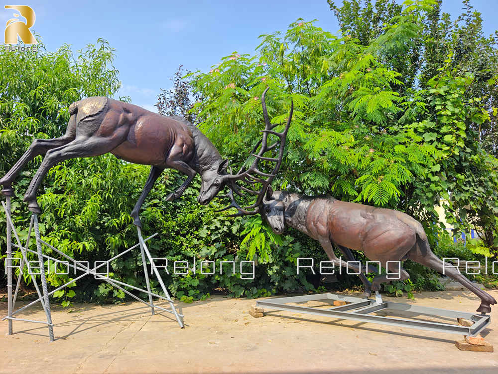 two elk fighting statue