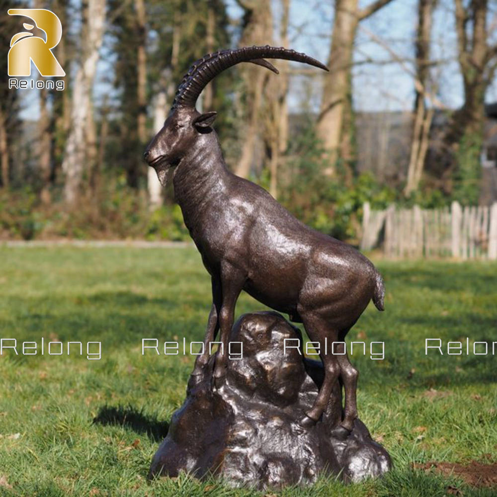 mountain goat on rock bronze sculpture