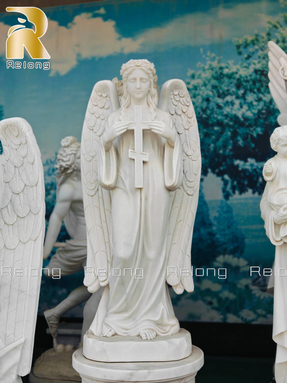 Sculpture of an angel holding a cross
