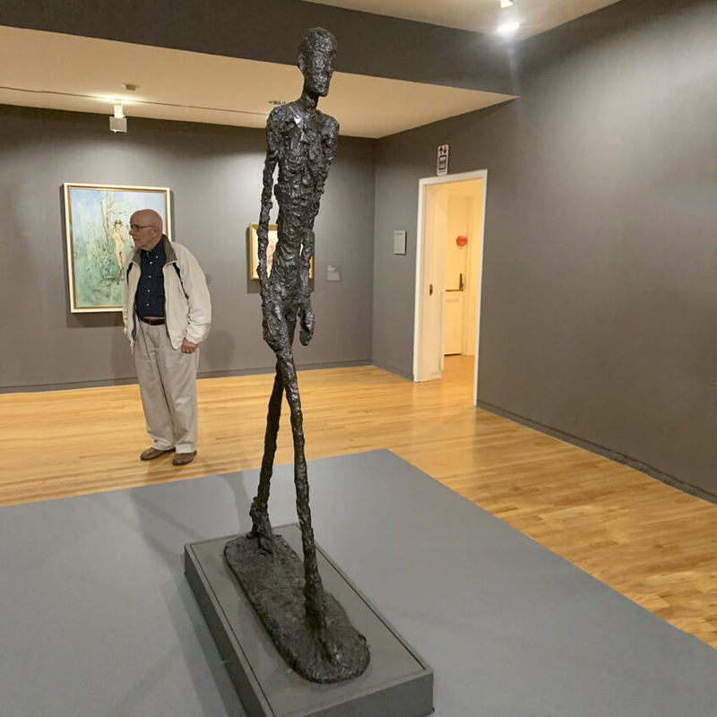 the walking man bronze figure sculpture by Giacometti