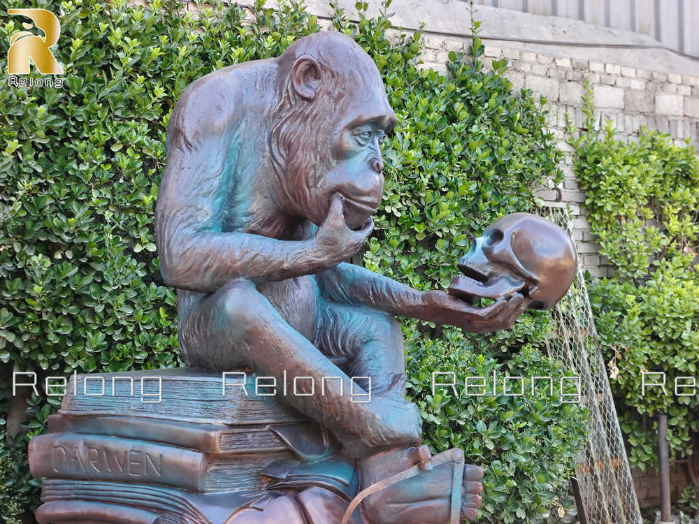 monkey holding skull statue detail
