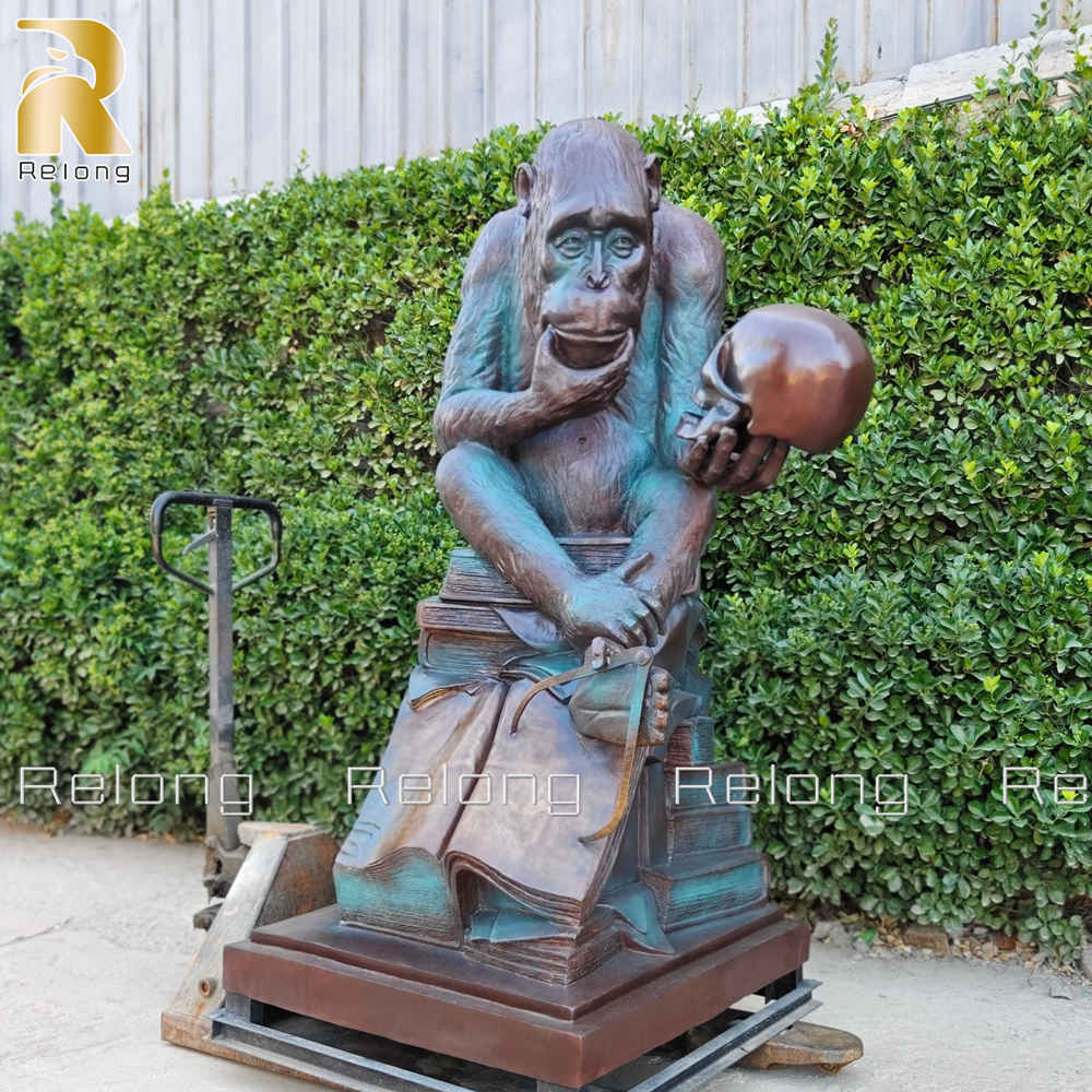 monkey holding skull statue