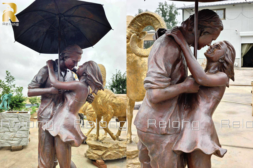 details of couple embracing sculpture