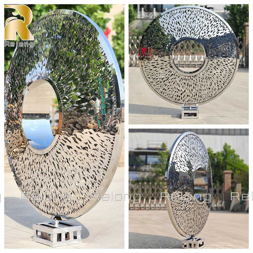 Detail of mirror polished stainless steel torus sculpture