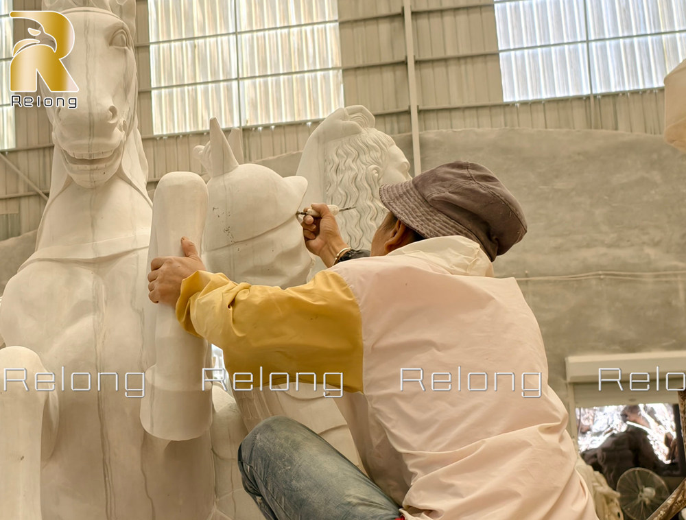 Hand-finishing the details of the sculpture