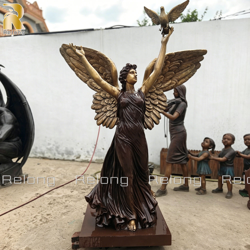 bronze angle holding dove sculpture