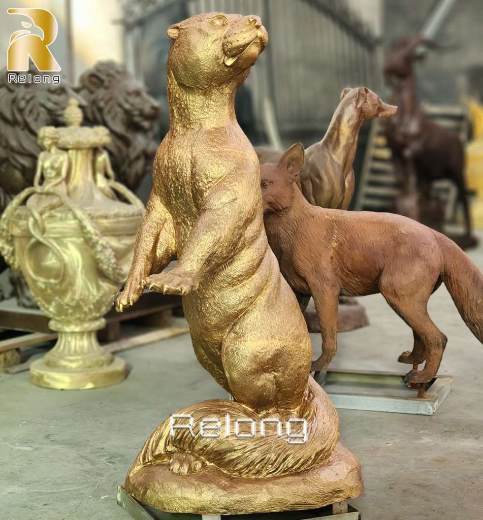 Golden Patina Finishing of bronze otter sculpture