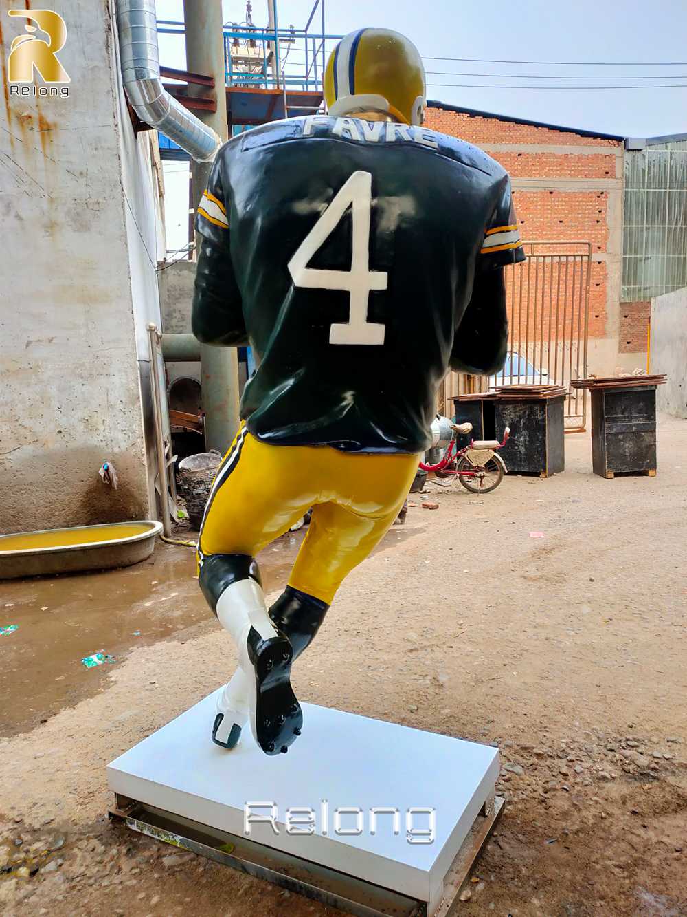 bronze rugby player statue action pose