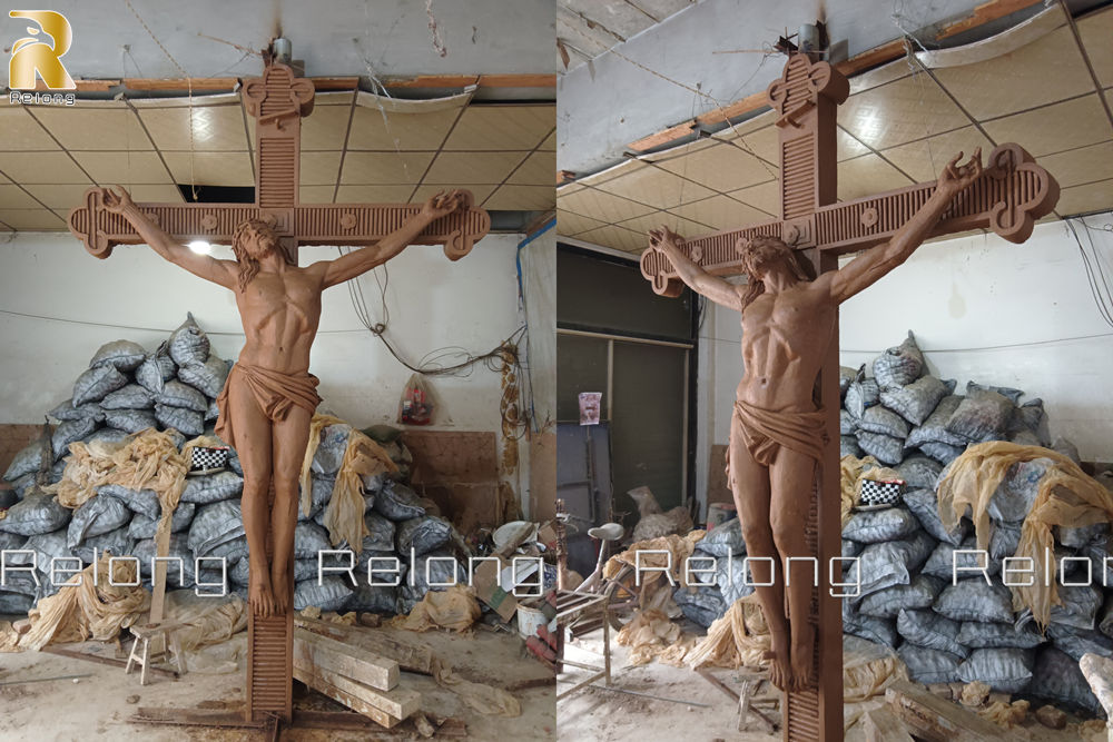 finished clay model of Jesus on cross