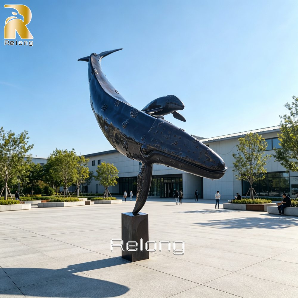 swimming mother and calf bronze whale sculpture