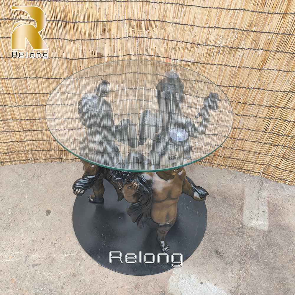 round bronze cherub coffee table
