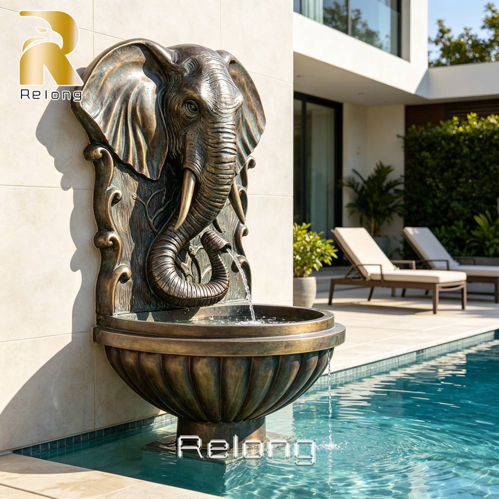bronze elephant fountain poolside