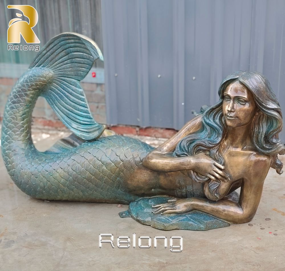 bronze reclining mermaid statue