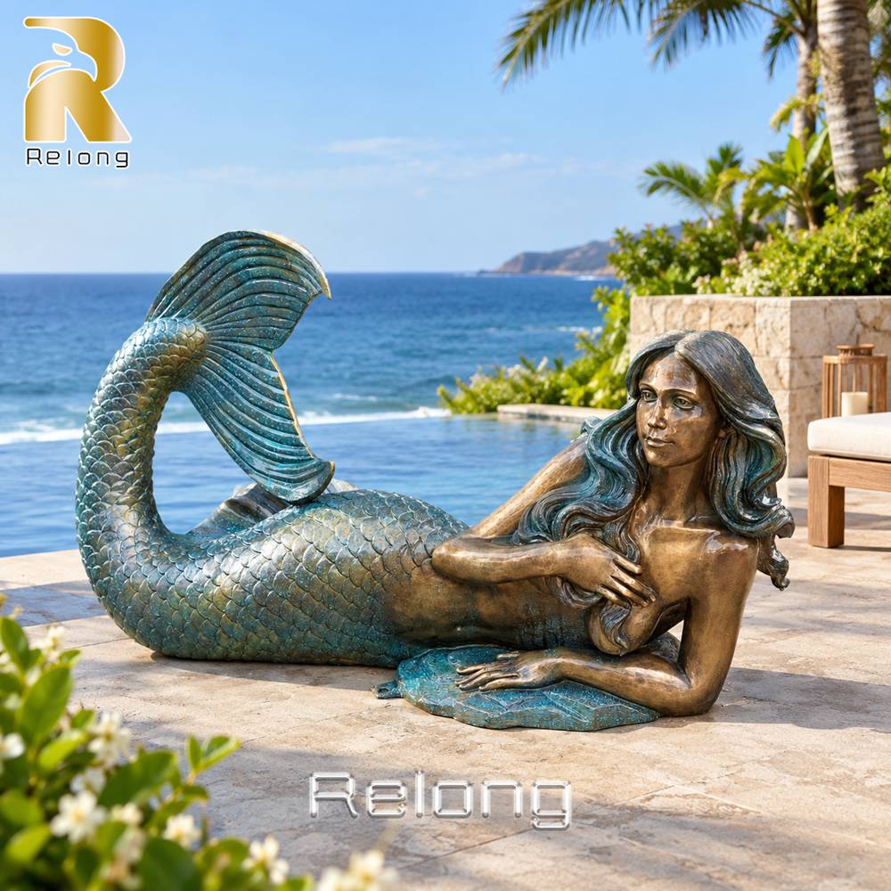reclining mermaid statue beach