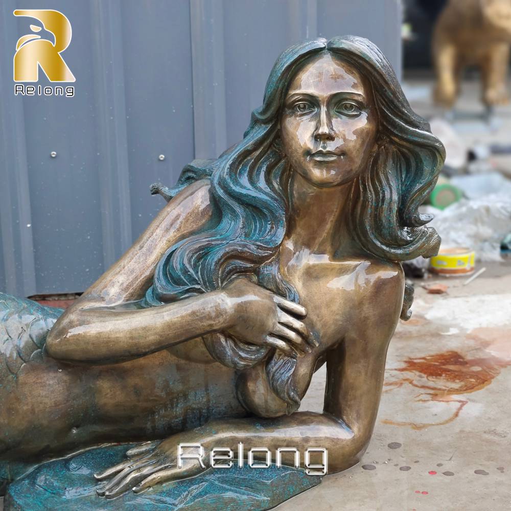 reclining mermaid statue face detail
