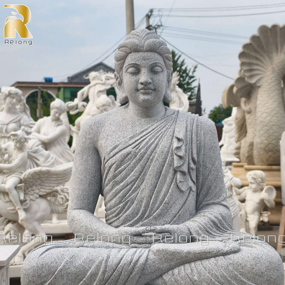 close up details of grey granite buddha statue