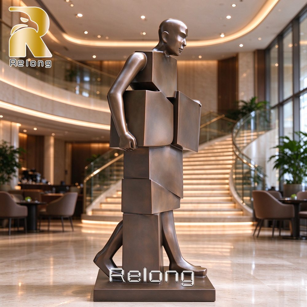 geometric bronze man sculpture lobby
